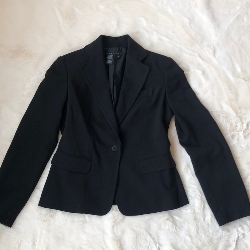 Parallel black blazer / suit separate. Lined with shoulder pads.